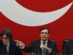 Pakistan Tehreek-e-Insaf (PTI) party's chairman Gohar Khan (R) speaks during a press conference in Islamabad. (AFP)