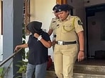 Suchana Seth with police officials. Suchana Seth with police officials.
