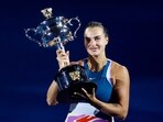 Belarus’ Aryna Sabalenka celebrates with the trophy after winning her final match against Kazakhstan’s Elena Rybakina 