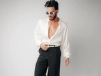 Ranveer Singh in a white satin shirt with puffed sleeves and pinstriped trousers (Photo: Instagram)