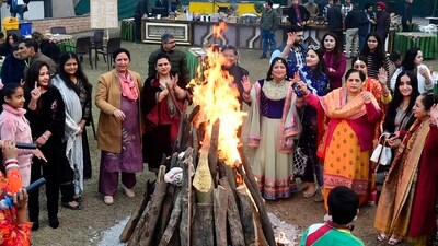 Members of the ladies' club in Ludhiana come together to celebrate Lohri in a joyous gathering.&nbsp; (Manish/HT Photo)