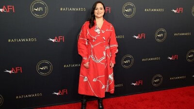 Lily Gladstone attends the AFI (American Film Institute) Awards Luncheon. She chore a printed red outfit for the event and paired it with black boots. She recently featured in the film, Killers of the Flower Moon.&nbsp; (REUTERS)