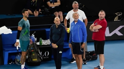 Serbia's Novak Djokovic, left, stands with his team during a practice session ahead of the Australian Open tennis championships at Melbourne Park, Melbourne, Australia (AP) Serbia's Novak Djokovic, left, stands with his team during a practice session ahead of the Australian Open tennis championships at Melbourne Park, Melbourne, Australia (AP)