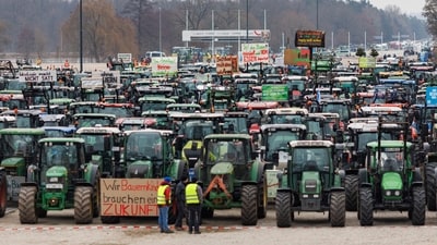Germany Famers' Protests: Numerous tractors are parked at the Volksfestplatz during a farmers' association rally against the federal government's austerity plans, in Nuremberg, Germany. (AP) Germany Famers' Protests: Numerous tractors are parked at the Volksfestplatz during a farmers' association rally against the federal government's austerity plans, in Nuremberg, Germany. (AP)