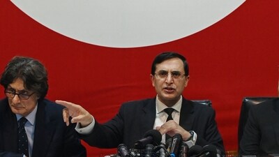 Pakistan Tehreek-e-Insaf (PTI) party's chairman Gohar Khan (R) speaks during a press conference in Islamabad. (AFP) Pakistan Tehreek-e-Insaf (PTI) party's chairman Gohar Khan (R) speaks during a press conference in Islamabad. (AFP)