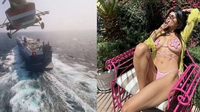 A Houthi helicopter flies above Galaxy Leader (Left) and Mia Khalifa (Right) (Hand Out and X) A Houthi helicopter flies above Galaxy Leader (Left) and Mia Khalifa (Right) (Hand Out and X)