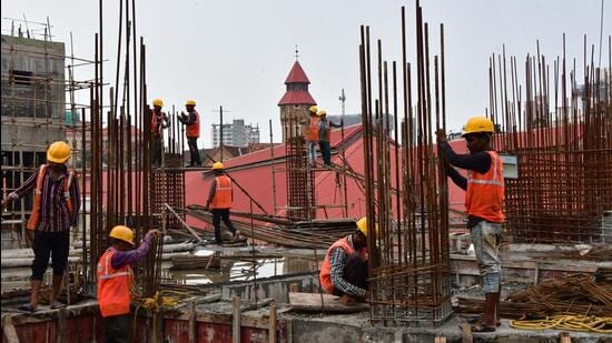 Mumbai, India – Oct 06, 2023: Labourers are seen working at a construction site, at Crawford Market, in Mumbai, India, on Friday, Oct 06, 2023. (Photo by Bhushan Koyande/HT Photo)