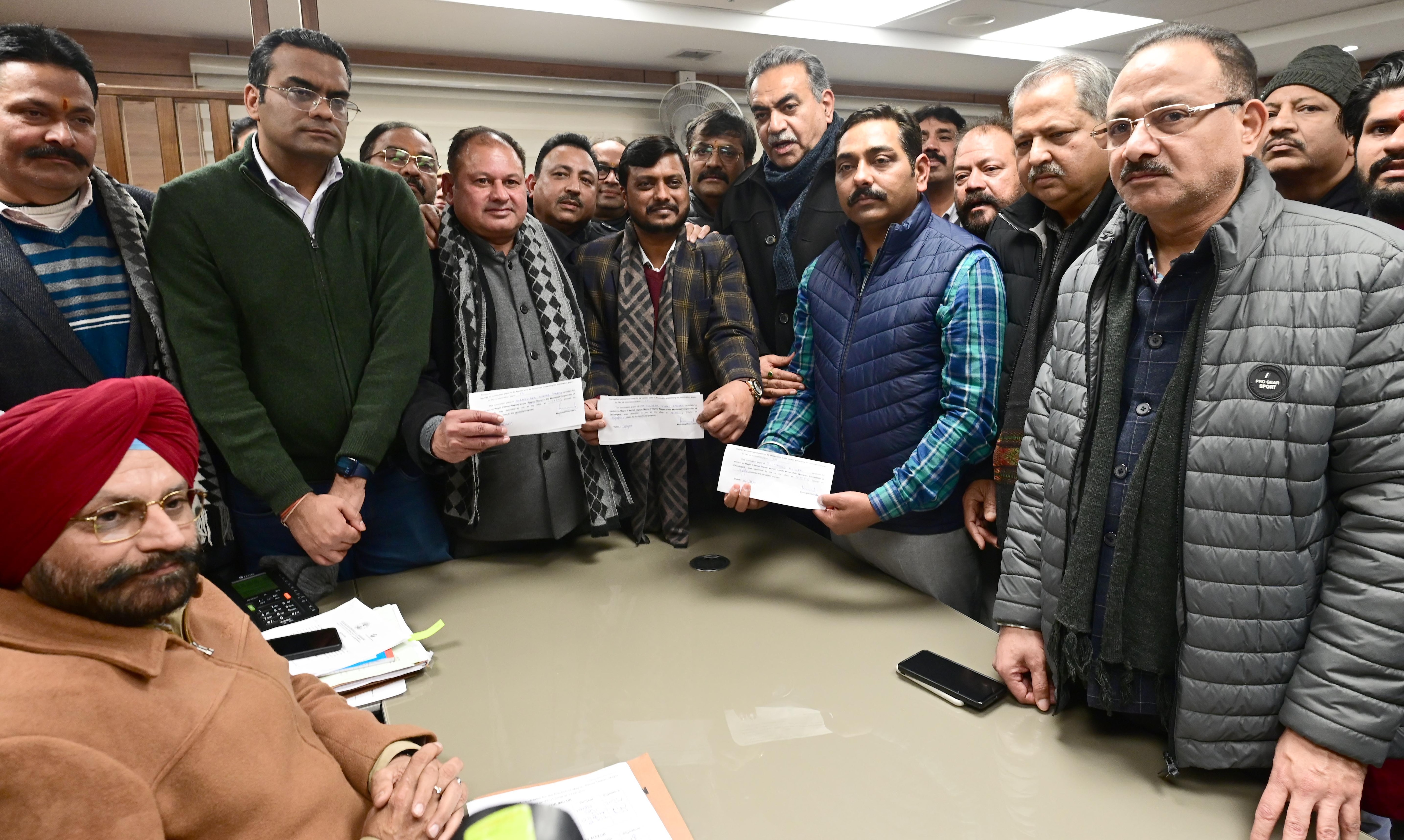 BJP candidates Manoj Sonkar, Kuljeet Sandhu and Rajinder Sharma filling their nominations for the posts of mayor, senior deputy mayor and deputy mayor posts, respectively, in Chandigarh on Saturday. (Ravi Kumar/HT) BJP candidates Manoj Sonkar, Kuljeet Sandhu and Rajinder Sharma filling their nominations for the posts of mayor, senior deputy mayor and deputy mayor posts, respectively, in Chandigarh on Saturday. (Ravi Kumar/HT)