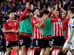 Athletic Bilbao players celebrate their win at the end of the Spanish league football match between Athletic Club Bilbao and Real Sociedad Athletic Bilbao players celebrate their win at the end of the Spanish league football match between Athletic Club Bilbao and Real Sociedad