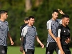 Inter Miami forward Luis Suarez, left, walks with forward Lionel Messi, center, and defender Sergio Busquets, second right, during an MLS soccer training session Inter Miami forward Luis Suarez, left, walks with forward Lionel Messi, center, and defender Sergio Busquets, second right, during an MLS soccer training session