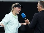 Denmark's Caroline Wozniacki talks to media after winning the women's singles match against Poland's Magda Linette as she pulled out of the match due to injury on day one of the Australian Open