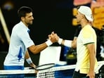 Serbia's Novak Djokovic shakes hands with Croatia's Dino Prizmic after winning their first round match