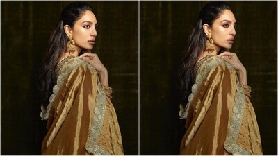 Assisted by celebrity fashion stylist Tanishq Malhotra, Sobhita accessorised her look with heavy gold jewellery, including a pair of statement earrings, rings adorning her fingers and multiple stacked bangles on her wrist. (Instagram/@sobhitad) Assisted by celebrity fashion stylist Tanishq Malhotra, Sobhita accessorised her look with heavy gold jewellery, including a pair of statement earrings, rings adorning her fingers and multiple stacked bangles on her wrist. (Instagram/@sobhitad)