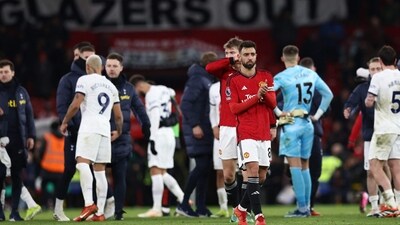 Manchester United's Portuguese midfielder #08 Bruno Fernandes (centre right) applauds fans on the pitch after the English Premier League football match between Manchester United and Tottenham Hotspur (AFP) Manchester United's Portuguese midfielder #08 Bruno Fernandes (centre right) applauds fans on the pitch after the English Premier League football match between Manchester United and Tottenham Hotspur (AFP)