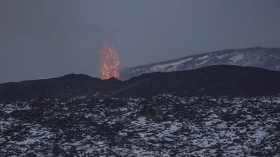 Lava spews from the site of a volcanic eruption north of Grindavik, Iceland, Flights in and out of Iceland to continue despite volcanic eruption, lava spread in near town (REUTERS/Marko Djurica/File Photo)