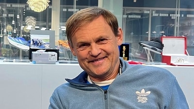 Adidas CEO Bjorn Gulden, holds a shoe worn by Ethiopia's Tigist Assefa when she set a new women's world record at the Berlin Marathon, finishing in 2 hours, 11 minutes and 53 seconds, during an interview at Adidas headquarters in Herzogenaurach, Germany, November 20, 2023. REUTERS/Helen Reid