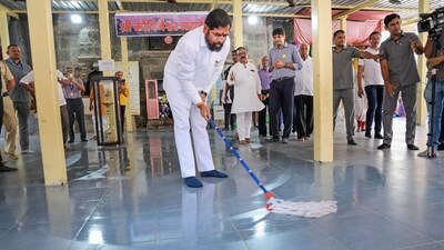 Maharashtra chief minister Eknath Shinde takes part in a cleanliness drive at Kopineshwar temple, in Thane, Saturday, Jan. 13. (PTI) Maharashtra chief minister Eknath Shinde takes part in a cleanliness drive at Kopineshwar temple, in Thane, Saturday, Jan. 13. (PTI)