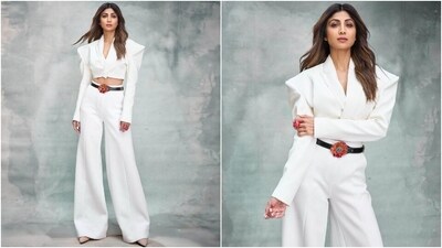 Another promotional look for the Indian Police Force series showed Shilpa transforming into a boss babe. She wore a white pantsuit featuring a cropped blazer, high-waisted flared pants, a black embellished belt, and nude pumps. She captioned the photos, "Damsel…never in distress." (Instagram) Another promotional look for the Indian Police Force series showed Shilpa transforming into a boss babe. She wore a white pantsuit featuring a cropped blazer, high-waisted flared pants, a black embellished belt, and nude pumps. She captioned the photos, "Damsel…never in distress." (Instagram)