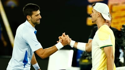 Serbia's Novak Djokovic shakes hands with Croatia's Dino Prizmic after winning their first round match (REUTERS)