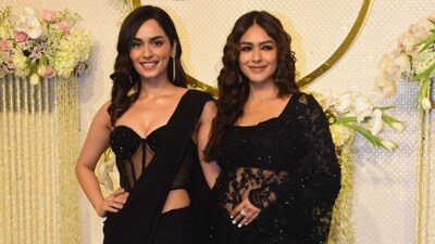 Both Manushi Chhillar and Mrunal Thakur found themselves twinning in black sarees as they came fact to face at Ira Khan and Nupur Shikhare's wedding reception in Mumbai on Saturday. Both Manushi Chhillar and Mrunal Thakur found themselves twinning in black sarees as they came fact to face at Ira Khan and Nupur Shikhare's wedding reception in Mumbai on Saturday. 
