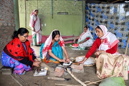 Women prepare 'pitha' (rice cake) as part of Magh Bihu (Bhogali Bihu) celebration at Da-Bassariya village, Tezpur in Sonitpur District of Assam. (ANI) Women prepare 'pitha' (rice cake) as part of Magh Bihu (Bhogali Bihu) celebration at Da-Bassariya village, Tezpur in Sonitpur District of Assam. (ANI)