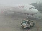 A dense blanket of fog enveloped Indira Gandhi International Airport in New Delhi.
