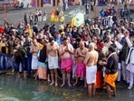 Congress leaders Avinash Pande, Deepender S Hooda, Ajay Rai along with party leaders and supporters take a holy dip in the Saryu river. 
