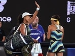 Naomi Osaka of Japan waves as she leaves Rod Laver Arena following her first round loss to Caroline Garcia