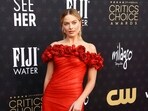 <p>Australian actor Margot Robbie arrives for show in a red floral gown. She was nominated in the Best Actress category for Barbie. She lost the award to Emma Stone for Poor Things.</p>(AFP)