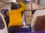 A passenger hits an IndiGo pilot when he was making an announcement regarding a delay in take-off at the Delhi airport on Sunday. 