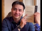 Man with his anniversary gift. 