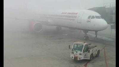 A dense blanket of fog enveloped Indira Gandhi International Airport in New Delhi on Sunday. Reportedly several flight operations got delayed at Delhi airport due to low visibility. (ANI Photo) A dense blanket of fog enveloped Indira Gandhi International Airport in New Delhi on Sunday. Reportedly several flight operations got delayed at Delhi airport due to low visibility. (ANI Photo)