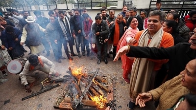 Jammu and Kashmir Bharatiya Janata Party President Ravinder Raina celebrates the Lohri festival at the party office in Jammu. (ANI) Jammu and Kashmir Bharatiya Janata Party President Ravinder Raina celebrates the Lohri festival at the party office in Jammu. (ANI)