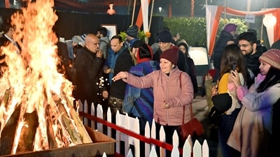 Bonfires, an important part of the festivities, were lit as families danced to the tunes of famous festival songs. (ANI) Bonfires, an important part of the festivities, were lit as families danced to the tunes of famous festival songs. (ANI)