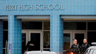 FILE PHOTO: A medical examiner enters the school as police respond to a school shooting at the Perry Middle School and High School complex in Perry, Iowa, U.S., January 4, 2024.  REUTERS/Cheney Orr  REFILE - QUALITY REPEAT   TPX IMAGES OF THE DAY/File Photo (REUTERS)