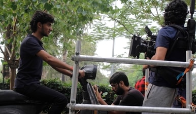 Kanu Behl behind the camera with lead actor Chetan Sharma, who plays the eponymous Binnu, sitting on a scooter in a behind-the-scenes shot during the filming of Binnu ka Sapna (Author) Kanu Behl behind the camera with lead actor Chetan Sharma, who plays the eponymous Binnu, sitting on a scooter in a behind-the-scenes shot during the filming of Binnu ka Sapna (Author)