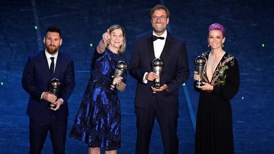 Lionel Messi poses after winning the Best FIFA Men's player award with the winner of the Best FIFA Men's coach award Liverpool manager Juergen Klopp, winner of the Best FIFA Women's player award USA's Megan Rapinoe Lionel Messi poses after winning the Best FIFA Men's player award with the winner of the Best FIFA Men's coach award Liverpool manager Juergen Klopp, winner of the Best FIFA Women's player award USA's Megan Rapinoe