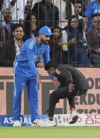 The pitch invader touched Kohli's feet (ANI) The pitch invader touched Kohli's feet (ANI)
