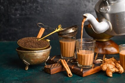A typical cup of cutting chai is offered with a side of biscuits (Shutterstock) A typical cup of cutting chai is offered with a side of biscuits (Shutterstock)
