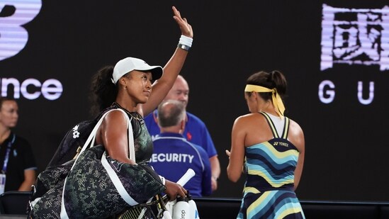 Naomi Osaka of Japan waves as she leaves Rod Laver Arena following her first round loss to Caroline Garcia (AP)