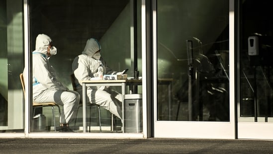 Covid In China: Security guards wearing personal protective equipment (PPE) (AFP)