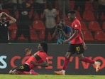 Angola's Mabululu, left, celebrates after scoring his side's first goal during the African Cup of Nations Group D soccer match between Algeria and Angola in Bouake