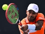India's Sumit Nagal hits a return against Kazakhstan's Alexander Bublik during their men's singles match on day three of the Australian Open