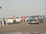 People are seen taking selfies at the Atal Setu in Mumbai.