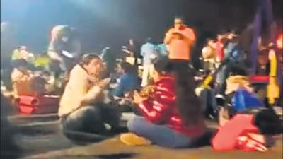 Passengers eating food on the Mumbai airport tarmac. Passengers eating food on the Mumbai airport tarmac.
