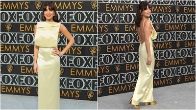 White Lotus star Aubrey Plaza walked the silver carpet at the Emmy Awards in a pale-yellow column dress. The gown is from Loewe’s Spring-Summer 2024 collection. It features an oversized sewing pin and an open back. She styled her ensemble with gold heels, a half-tied hairdo, red wine lips, and bejewelled rings. (AP, AFP) White Lotus star Aubrey Plaza walked the silver carpet at the Emmy Awards in a pale-yellow column dress. The gown is from Loewe’s Spring-Summer 2024 collection. It features an oversized sewing pin and an open back. She styled her ensemble with gold heels, a half-tied hairdo, red wine lips, and bejewelled rings. (AP, AFP)