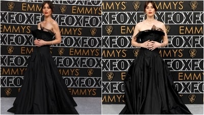 Lizzy Caplan wore an elegant black vintage Yohji Yamamoto dress at the Emmy Awards 2024. The strapless gown has a corseted bodice, pleated skirt, and a cinched waist. She styled the look with rings, earrings, a dainty bracelet, red lip shade, winged eyeliner, mascara on the lashes, and a messy low bun. (AFP, Reuters) Lizzy Caplan wore an elegant black vintage Yohji Yamamoto dress at the Emmy Awards 2024. The strapless gown has a corseted bodice, pleated skirt, and a cinched waist. She styled the look with rings, earrings, a dainty bracelet, red lip shade, winged eyeliner, mascara on the lashes, and a messy low bun. (AFP, Reuters)