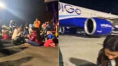 In a viral video, passengers of a Delhi-bound IndiGo flight diverted to Mumbai due to operational issues are seen eating and sitting on the airport tarmac at Mumbai Airport, in Mumbai on Monday. (ANI) In a viral video, passengers of a Delhi-bound IndiGo flight diverted to Mumbai due to operational issues are seen eating and sitting on the airport tarmac at Mumbai Airport, in Mumbai on Monday. (ANI)