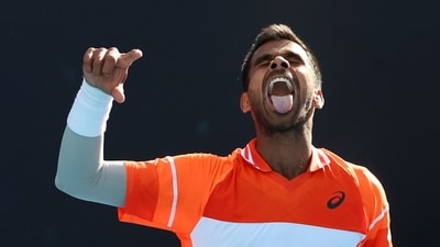 Sumit Nagal of India celebrates after defeating Alexander Bublik of Kazakhstan in their first round match at the Australian Open (AP)