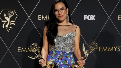 Ali Wong adorned a Louis Vuitton outfit consisting of a silver top and a floral-patterned blue bottom. Both pieces featured chunky embellishments that caught the lights on the carpet, adding to the overall glamour of her ensemble.&nbsp; (REUTERS)